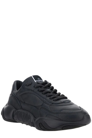 Black calf leather Valentino Garavani sneakers with sleek design and white rubber sole, showcasing modern sneaker style.
