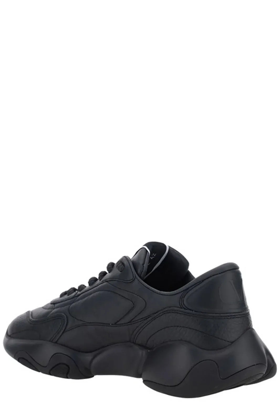 Black Valentino Garavani calf leather sneakers with sleek design and white rubber soles, stylish footwear for casual wear.