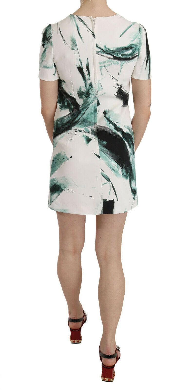 White, black, and blue Dolce & Gabbana mini dress featuring a stylish shift design, short length, and vibrant color block pattern.