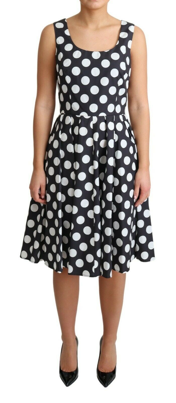 Black polka dotted cotton A-line dress by Dolce & Gabbana, featuring a classic fit and playful pattern.
