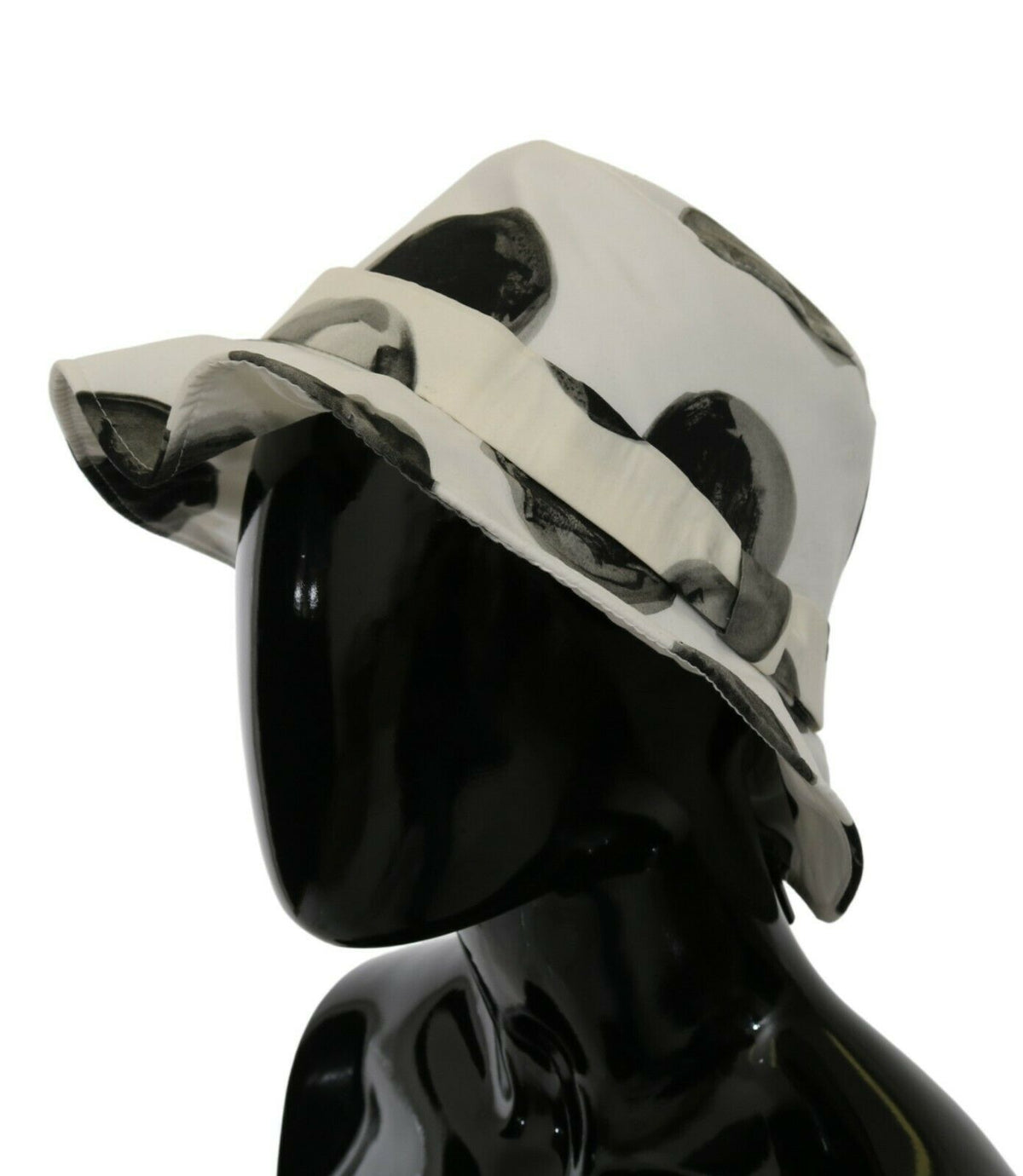 White cotton bucket hat with large black polka dot pattern by Dolce & Gabbana, shown from a front angle.