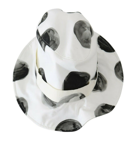 White cotton bucket hat with large black polka dot pattern from Dolce & Gabbana, stylish sun protection accessory.