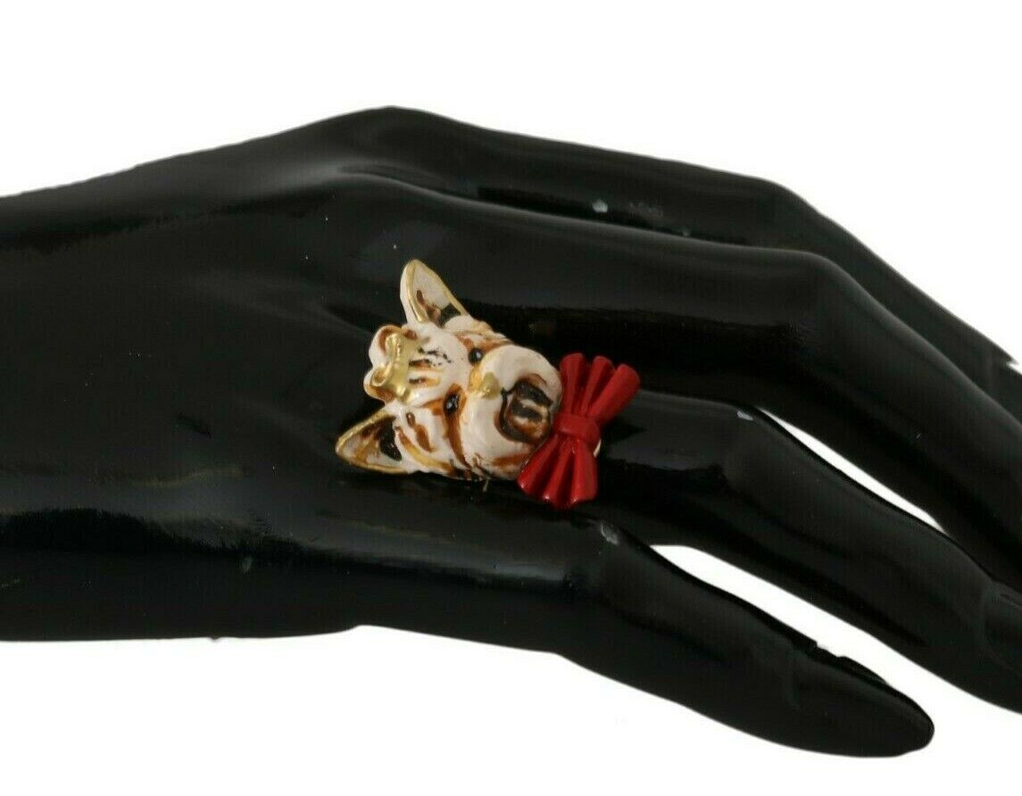 Gold brass resin beige dog pet accessory ring with branded logo from Dolce & Gabbana, featuring a stylish design.