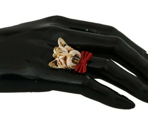 Gold brass resin beige dog pet accessory ring with branded logo from Dolce & Gabbana, featuring a stylish design.