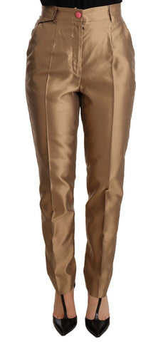 Gold silk tapered trousers with metallic finish from Dolce & Gabbana, showcasing a sleek, tailored style.