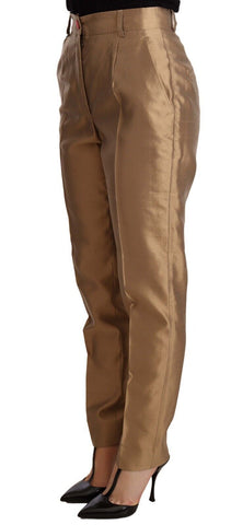 Gold silk tapered trousers with metallic finish from Dolce & Gabbana, featuring a sleek, tailored fit and elegant design.