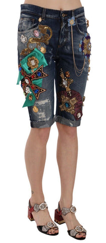 Blue denim mid-waist Capri shorts with crystal embellishments from Dolce & Gabbana, shown on a model.
