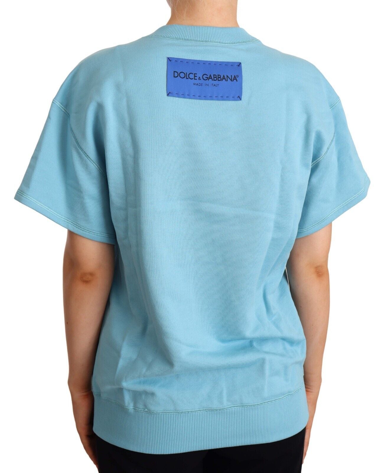 Blue cotton short sleeve crew neck top by Dolce & Gabbana, shown on a model with a casual fit and clean design.