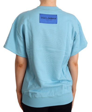 Blue cotton short sleeve crew neck top by Dolce & Gabbana, shown on a model with a casual fit and clean design.