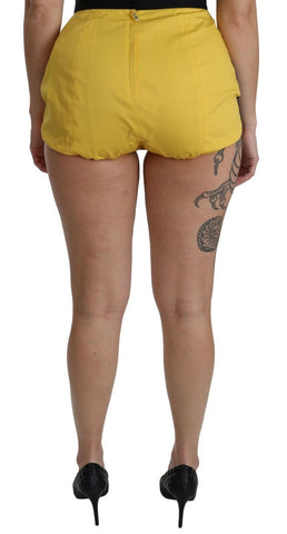 Yellow and black cotton hot pants shorts with jeweled embellishments by Dolce & Gabbana, featuring a stylish and bold design.