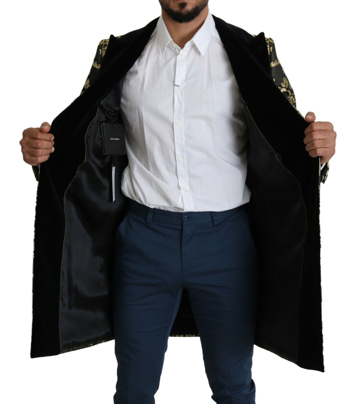 Black gold jacquard long coat, Dolce & Gabbana Sicilia jacket with intricate pattern and tailored fit, shown on a model.