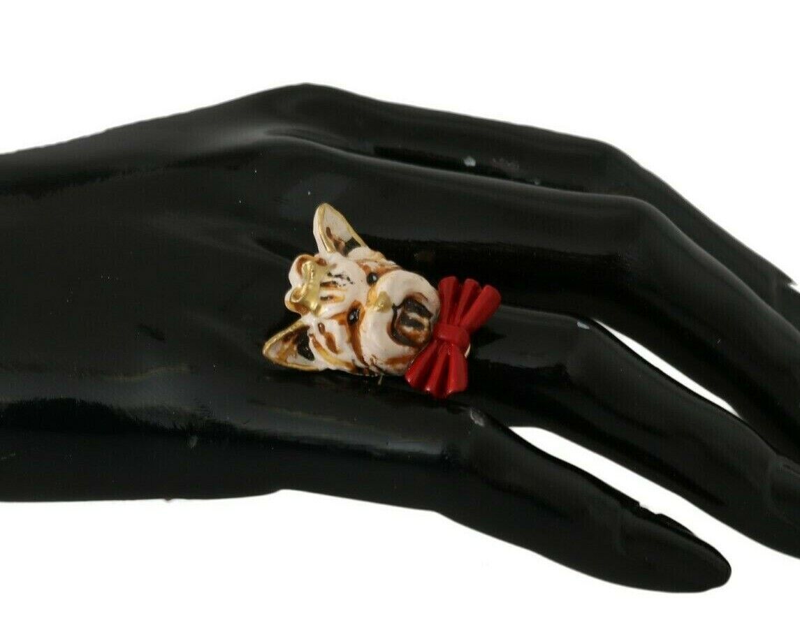 Beige dog-themed accessory by Dolce & Gabbana featuring a gold brass resin ring with pet design details.