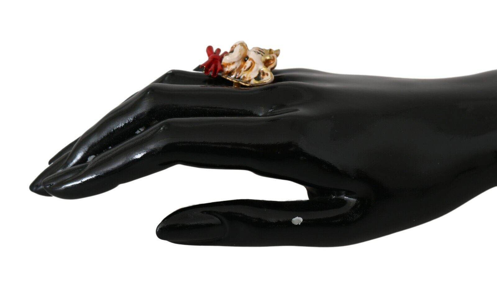 Beige dog-themed pet accessory with gold brass resin ring, branded by Dolce & Gabbana, featuring detailed design and elegant craftsmanship.