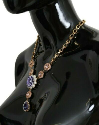 Pink gold brass pendant with purple pearls and crystal accents, by Dolce & Gabbana, featuring a delicate, elegant jewelry design.