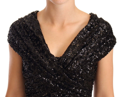 Black sequined open shoulder long gown dress by Dolce & Gabbana, featuring elegant design and shimmering fabric.