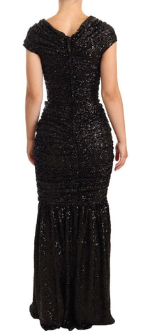 Black sequined open shoulder long gown dress by Dolce & Gabbana, featuring elegant design and shimmering embellishments.