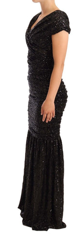 Black sequined open shoulder long gown dress by Dolce & Gabbana, featuring elegant design and shimmering embellishments.