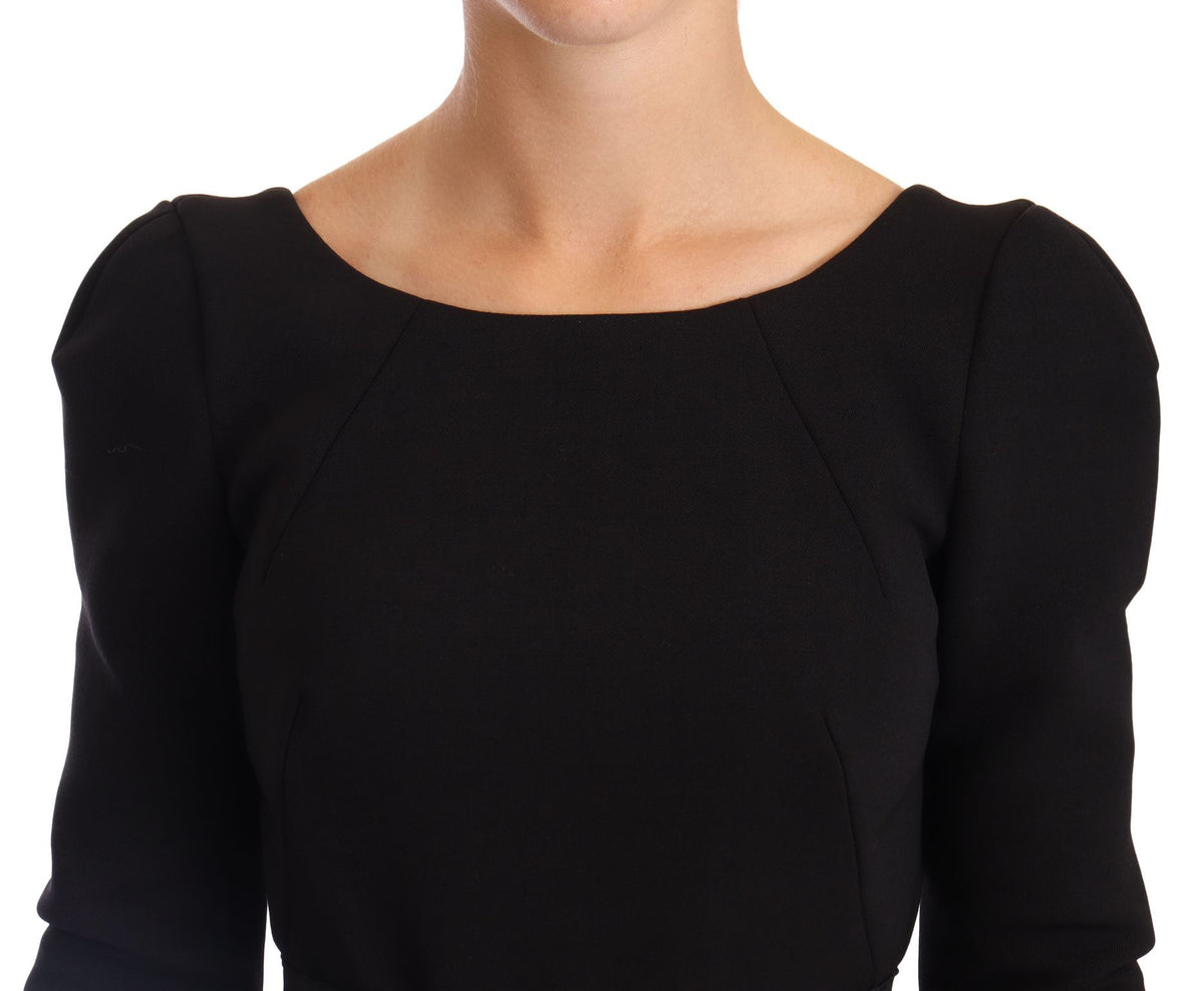 Black wool stretch sheath dress with open back by Dolce & Gabbana, showcasing a fitted silhouette and elegant design.