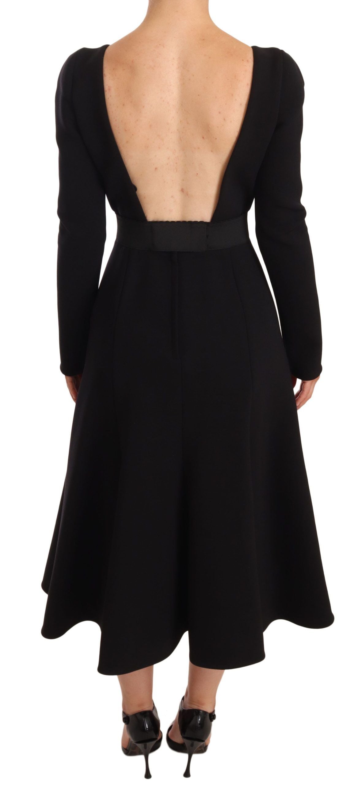 Black wool stretch sheath dress with open back by Dolce & Gabbana, fitted silhouette and elegant design.