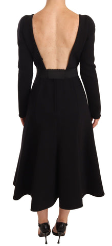Black wool stretch sheath dress with open back by Dolce & Gabbana, fitted silhouette and elegant design.