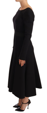 Black wool stretch sheath dress by Dolce & Gabbana with an open back, tailored fit, and elegant design.