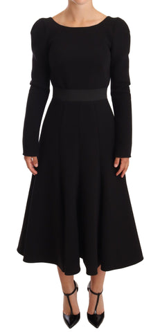 Black wool stretch sheath dress with open back by Dolce & Gabbana, fitted silhouette and elegant design.