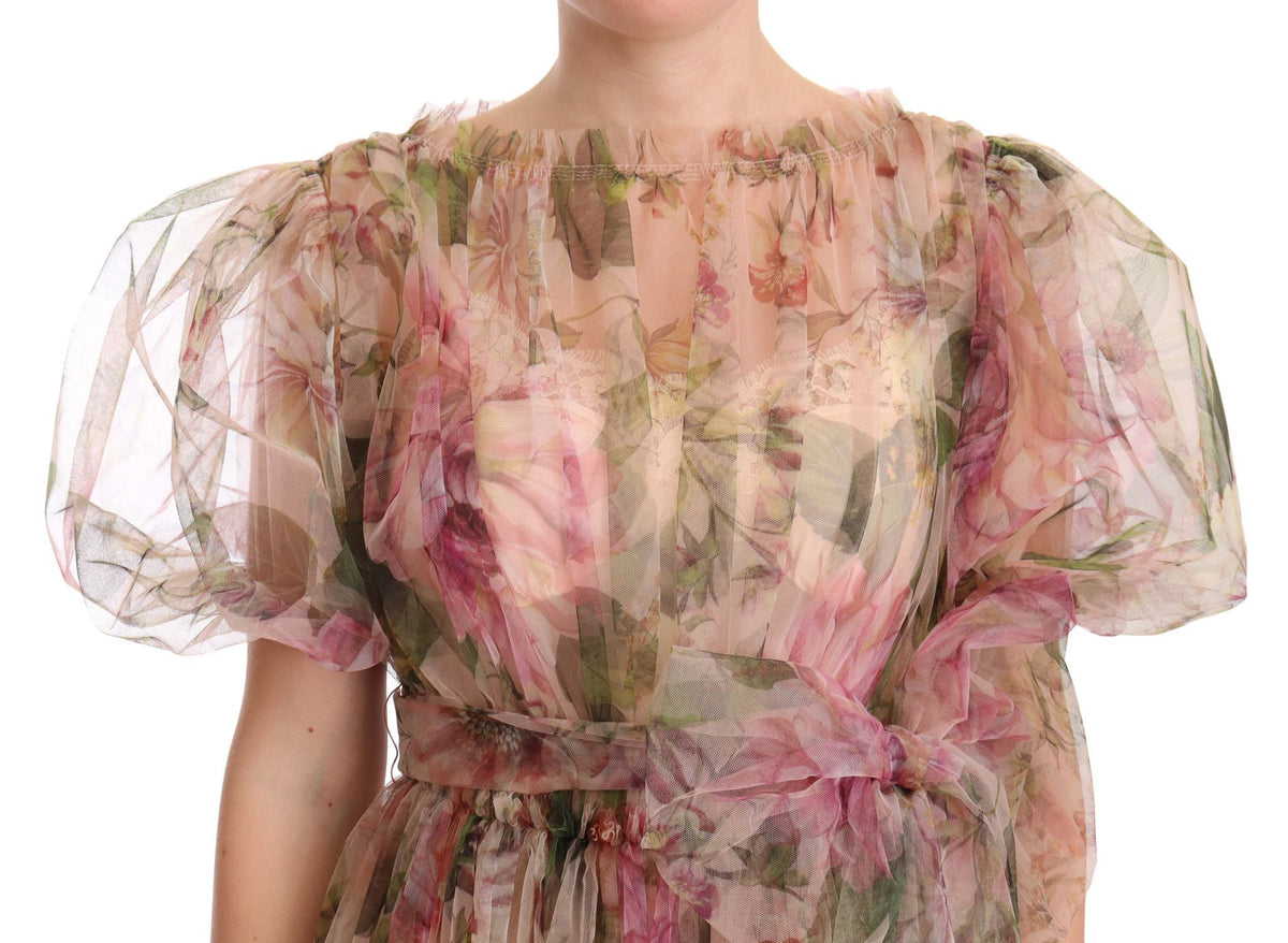 Multicolor floral print long maxi gown dress by Dolce & Gabbana with flowing fabric and vibrant floral pattern.