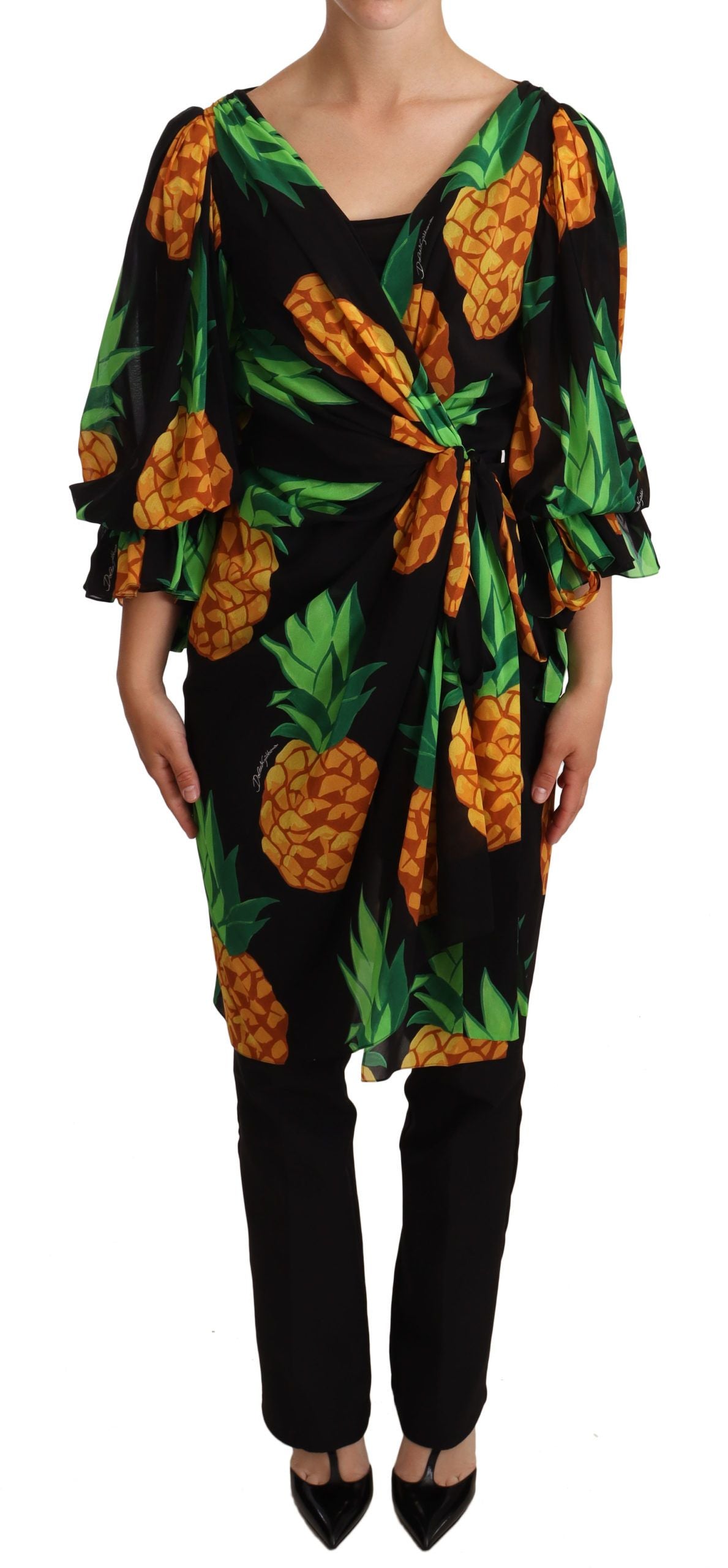 Black silk wrap dress with an ananas print by Dolce & Gabbana, featuring a fitted silhouette and elegant design.
