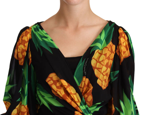 Black silk wrap dress with ananas print by Dolce & Gabbana, featuring a fitted silhouette and elegant design.