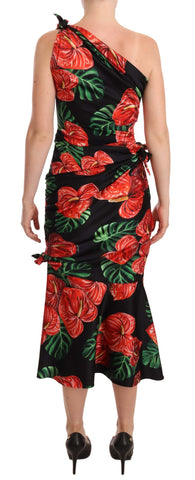 Black shiny silk floral print draped dress by Dolce & Gabbana, featuring elegant fabric and a flowing silhouette.