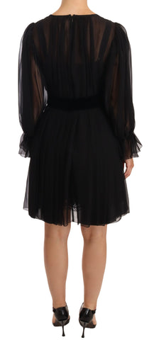 Black mesh pleated mini silk stretch dress by Dolce & Gabbana, featuring a fitted silhouette and elegant pleated design.