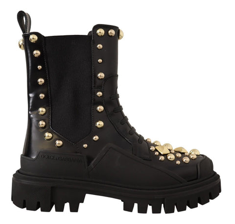 Black leather studded combat boots by Dolce & Gabbana with rugged design and metal stud details, featuring lace-up front and chunky sole.