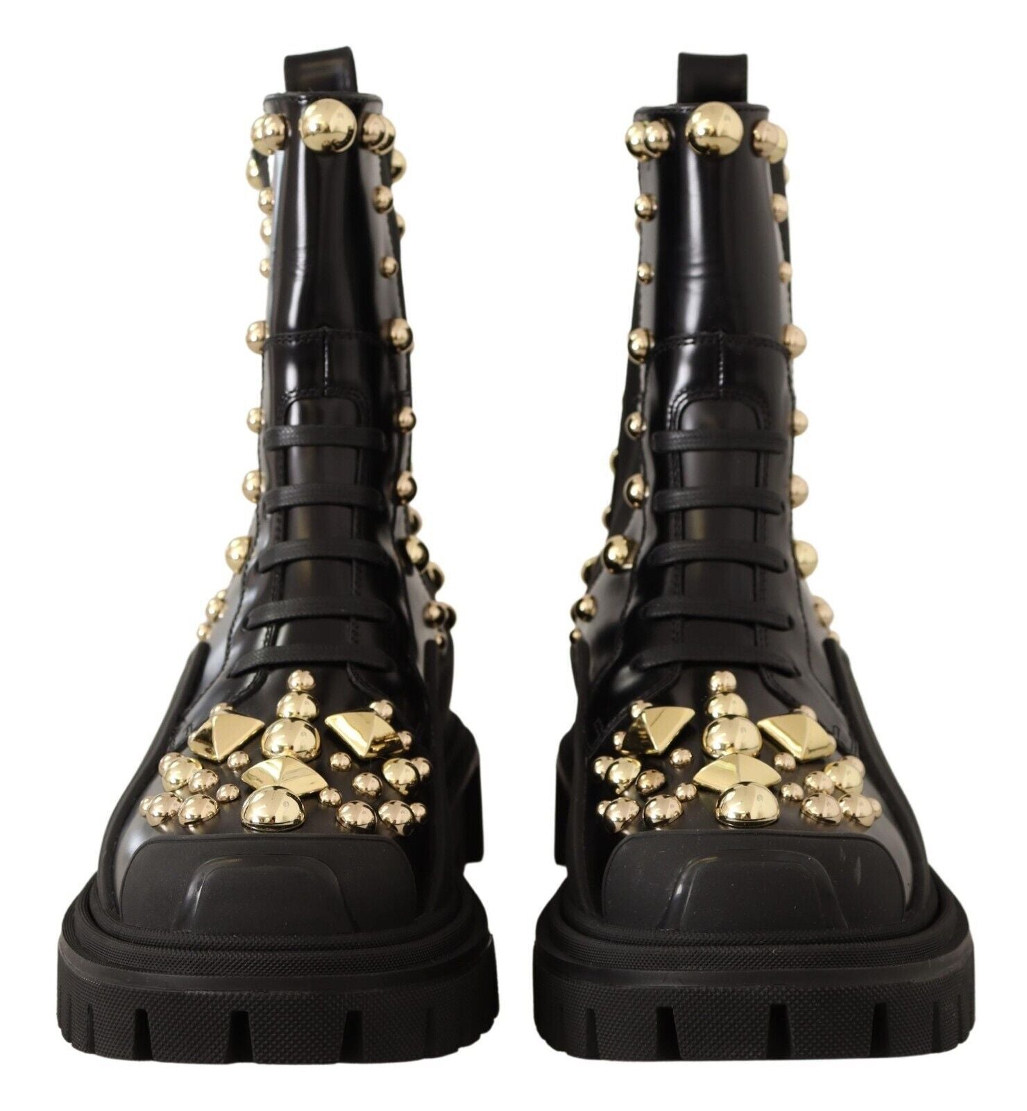 Black leather studded combat boots by Dolce & Gabbana with chunky soles and metal stud accents, stylish and sturdy footwear.