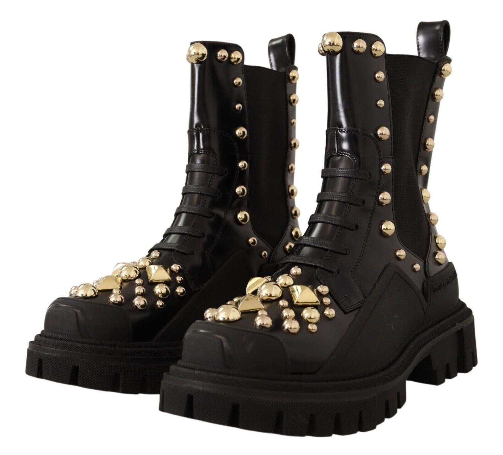 Black leather studded combat boots by Dolce & Gabbana with chunky soles and metal stud embellishments.