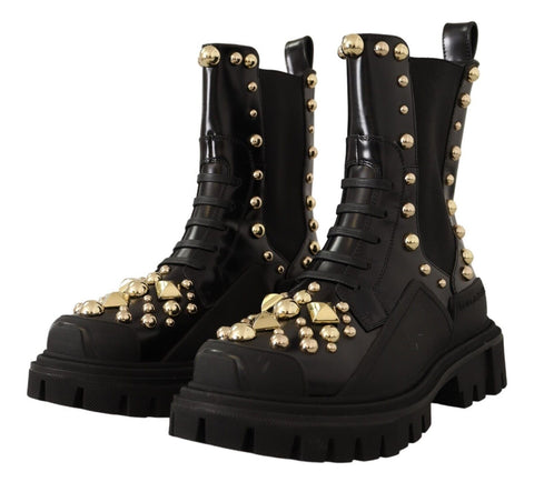 Black leather studded combat boots by Dolce & Gabbana with chunky soles and metal stud embellishments.