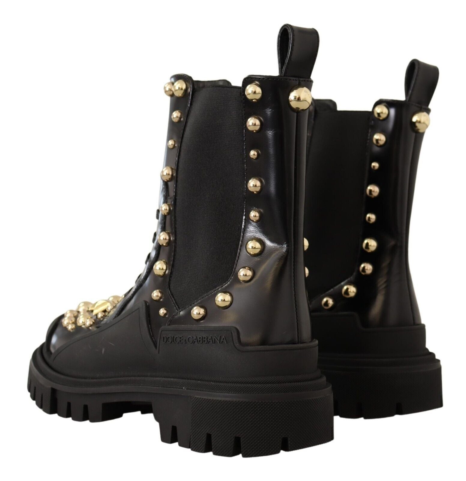 Black leather studded combat boots by Dolce & Gabbana with rugged design and metal stud accents, perfect for edgy fashion.