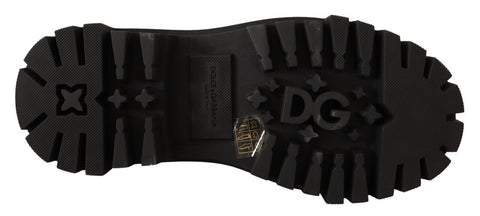 Black leather combat boots with silver studs from Dolce & Gabbana, featuring a rugged combat style and lace-up design.