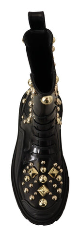 Black leather combat boots with studded details from Dolce & Gabbana, featuring chunky soles and classic lace-up design.