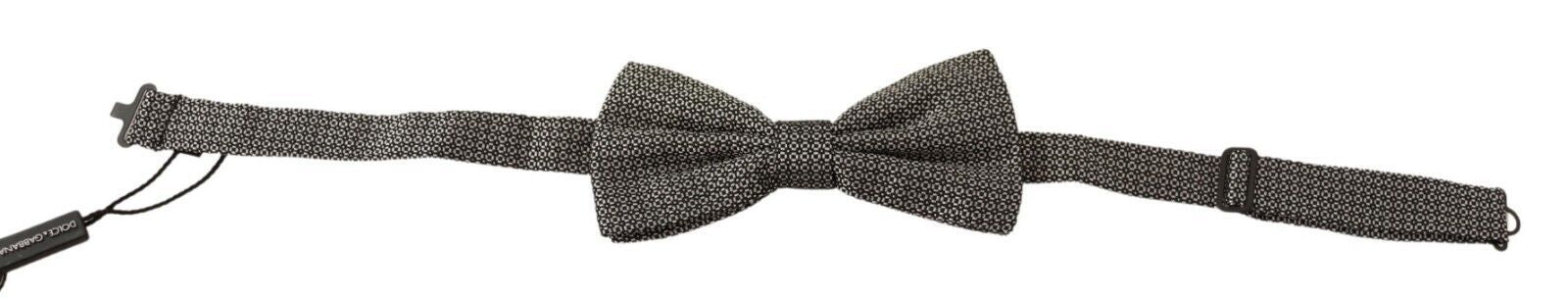 Multicolor patterned Dolce & Gabbana adjustable neck papillon bow tie displayed on a white background.