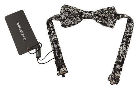 Multicolor floral adjustable neck papillon bow tie by Dolce & Gabbana, featuring vibrant floral patterns and elegant design.