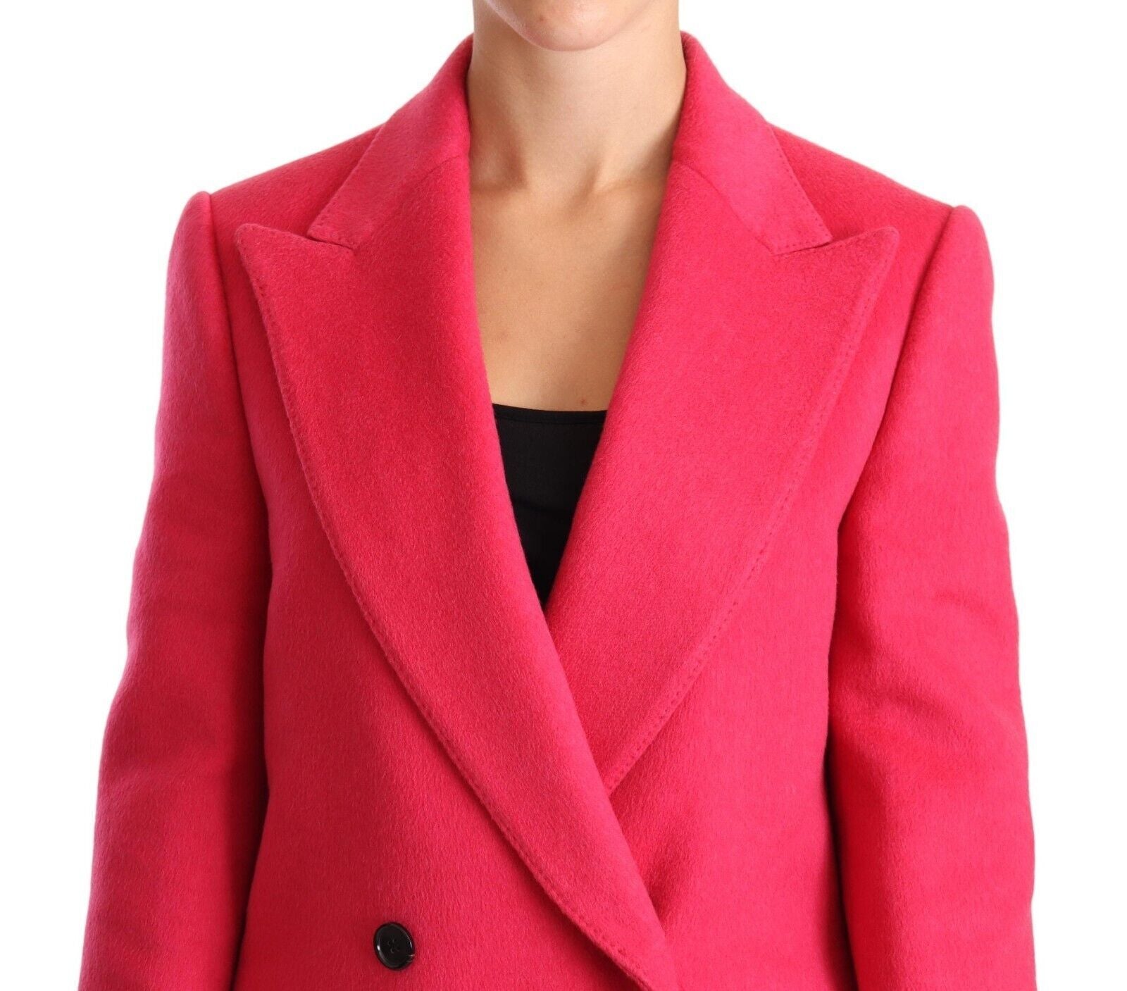 Pink Dolce & Gabbana double-breasted trenchcoat jacket with wide lapels and belt, stylishly displayed on a hanger.