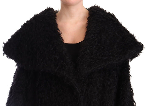 Black mohair fur cape trench coat jacket by Dolce & Gabbana, shown on a model with luxurious textured fabric and classic silhouette.