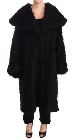 Black mohair fur cape trench coat by Dolce & Gabbana, featuring luxurious fabric and stylish design with button details.