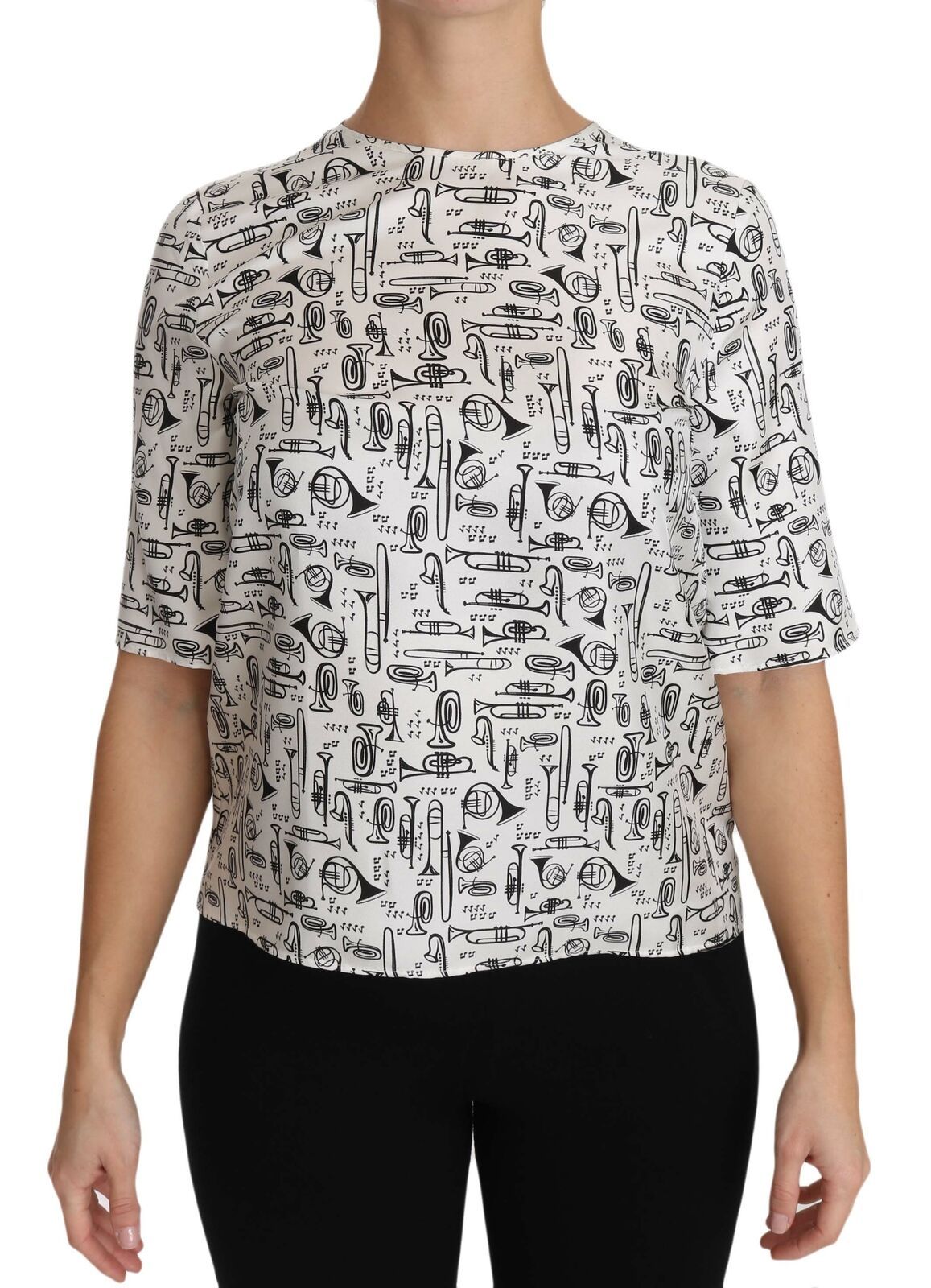 White blouse with musical instrument print by Dolce & Gabbana, featuring long sleeves and a stylish, elegant design.