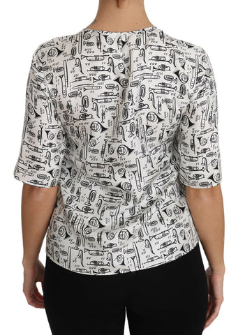 White blouse with musical instruments print from Dolce & Gabbana, featuring a stylish, lightweight design and elegant long sleeves.