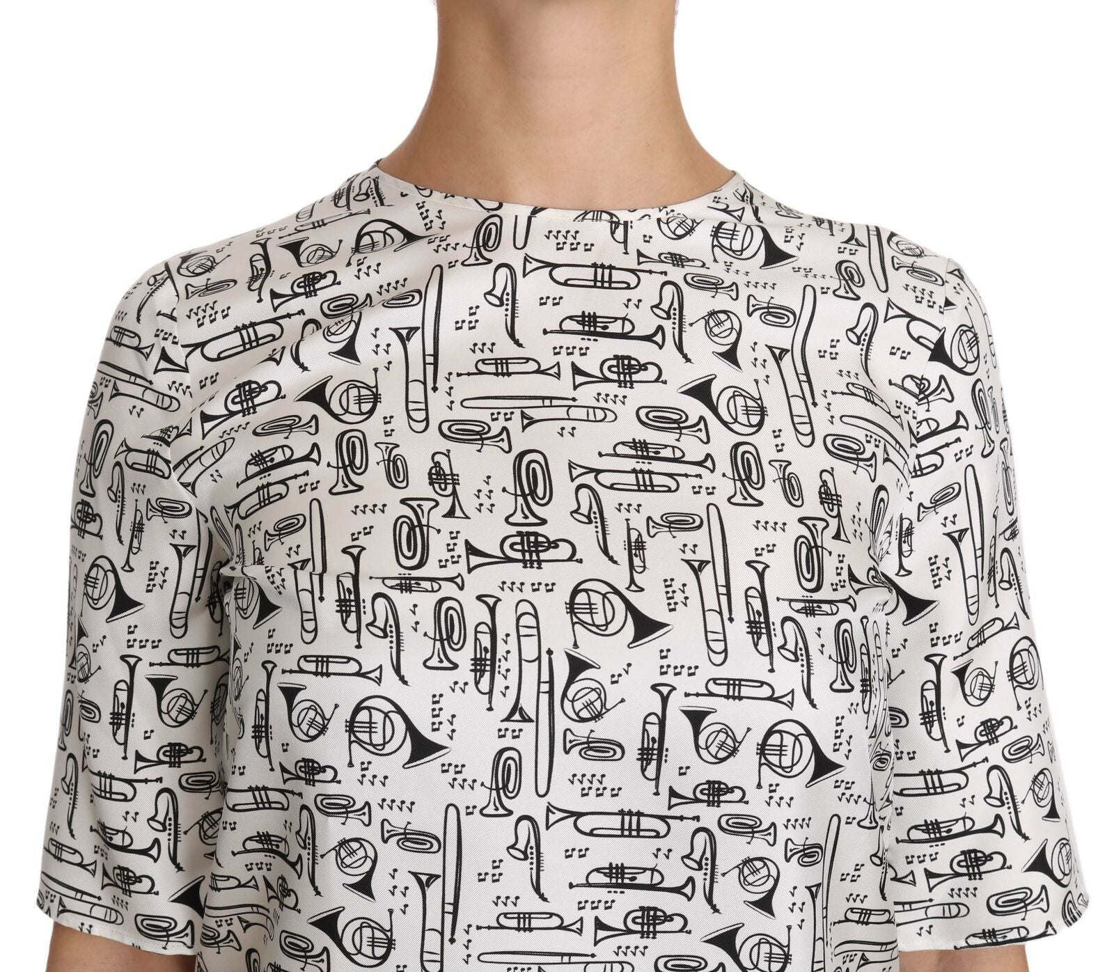 White blouse by Dolce & Gabbana featuring musical instruments print, long sleeves, and a classic fit.