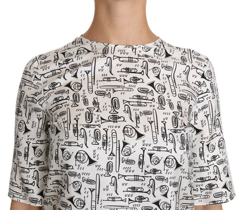 White blouse by Dolce & Gabbana featuring musical instruments print, long sleeves, and a classic fit.