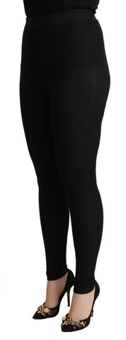 Black cashmere stretch waist tights pants by Dolce & Gabbana, showing the smooth fabric and fitted design.