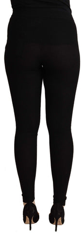 Black cashmere stretch waist tights pants by Dolce & Gabbana, showing the fitted waistband and smooth fabric texture.