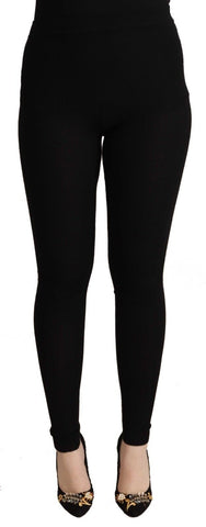 Black cashmere stretch waist tights pants by Dolce & Gabbana, shown on a model, highlighting the smooth, fitted design and luxurious fabric.